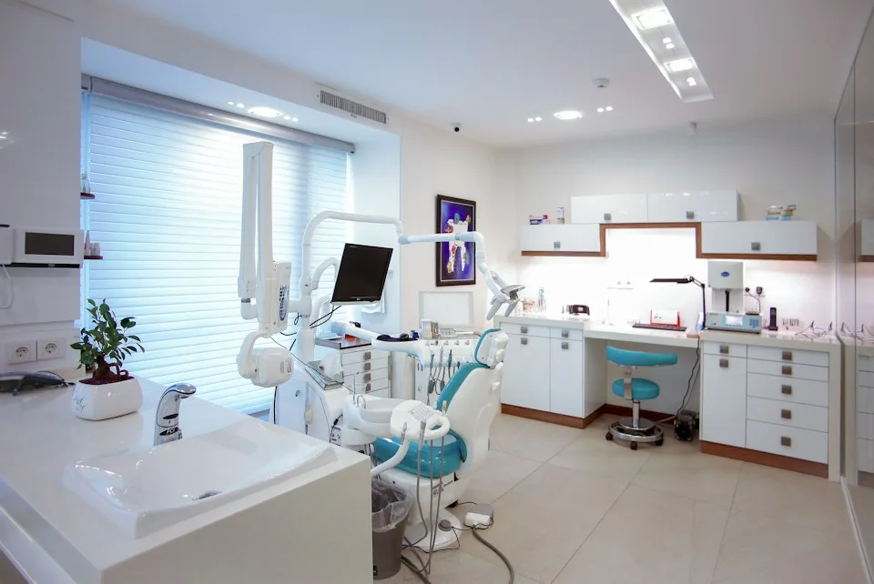 Bright dental treatment room with a patient chair